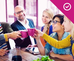 A group of young professionals toasting together