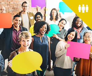 A group of professionals smiling and holding speech balloons